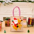 Christmas burlap gift bag with Santa Claus and reindeer design and red striped handles - Striped Handle Santa Riding Reindeer