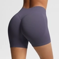 Close-up of high-waist seamless gym shorts showing peach lift stitching and breathable texture - Truffle