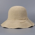 Handmade woven straw sun hat for women with beige wavy brim and string bow decoration - Beige