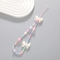 Detailed view of beaded phone strap with colorful pearls, floral charms, and a bow ornament - Colorful Bow Flower Beaded (K2080)