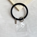 Black silicone phone wrist strap with silver metal clip and transparent connector - Black
