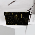 Waterproof toiletry bag with golden mystic astrology patterns on black background - Black Gold Astrology