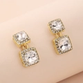 Detail of square gold earrings featuring centered rhinestones and hollow side patterns - Double Layer Square Zirconia Earrings / Gold