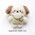 Detailed view of 8.5x7.5cm white plush dog charm wearing a green striped knit vest - Green
