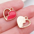 Red heart enamel charm and golden textured half-heart pendant on fingertip - Red Heart (11036)
