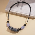 Detail of bohemian leather cord necklace with grey marble acrylic beads and gold hardware - Grey Marble (Necklace-Transparent)