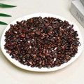 Polished red jasper irregular crystal stones displayed on a white round ceramic plate - Red Tiger Eye (5-7mm) 100g