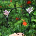 Detailed view of pink quartz crystals hand-wrapped on a black cat ear headband - No.36 Garnet Red