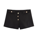 Pantaloncini neri a vita bassa da donna con bottoni dorati decorativi su sfondo bianco - XS / Nero
