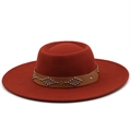 Close-up of red wool felt fedora featuring a brown leather band with silver metal rivets - M / Caramel
