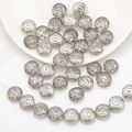 Macro detail of spiral textured silver grey glass beads for DIY jewelry making - Smoke Gray
