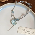 Detail view of multi-layer ocean necklace with starfish charms and shell pendant - Silver Chain Multi-layer Conch Shell Necklace