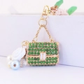 Golden handbag keychain with green rhinestones, white rose and pearl charms - Individual Packaging / Green