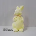 Adorable yellow flocked Easter rabbit figurine with a straw bow tie decoration, 31cm height - Yellow (Height 31cm)
