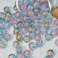Detailed macro view of 10mm pink and blue frosted glass beads with gold wire textures - Pale Blue