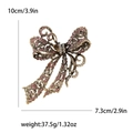 Vintage-Schleifenbrosche mit rosa Kristallen, Bronze-Finish, 10 cm x 7,3 cm - Rosa