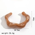 Detailed view of amber resin bangle showing dimensions 70mm by 84.5mm and 26.6g weight - Amber Brown Wavy Open Style (TB7208-CF)
