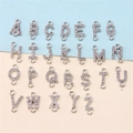 Detailed view of 26 alphabet charms with rhinestones and double rings for DIY jewelry - Rhinestone Alphabet Set (DY147) / Set of 26 / Style 74 Double Loop Full Rhinestone White K