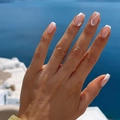 Classic French style press-on nails with white wave design against a coastal background - XA-32-19 White Wavy Lines French Style