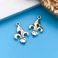 Silver vintage fleur-de-lis metal charms on blue background for DIY jewelry making - Lily 12x19mm