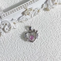 Detailed macro of a pink heart pendant with zircon butterfly and 18K gold plating - Type A Silver