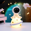 Astronaut sitting on yellow moon night light with stars and glowing blue ring - Girly Style / 999-2 Astronaut Planet Light Sitting / Blue