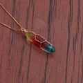 Top view of a gold wire wrapped hexagonal rainbow crystal column pendant on a fine chain - A-NSN0235 Gold Copper Box Chain