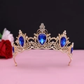 Detail of baroque vintage golden crown with large blue teardrop gems and white crystals - No.11 KC Gold (Royal Blue Stone)