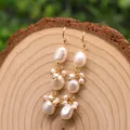 Baroque pearl and lapis lazuli long drop earrings with gold hooks on wood background - Baroque 3-Layer / White