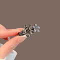 Small floral hair claw clip featuring grey rhinestones on a black metal base - 13# Flower Side Rhinestone Clip (Approx. 4CM)