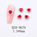 Macro view of 7.5x8mm red heart nail gems with gold base and tiny clear rhinestones - Micro-Pave Heart Border Nail Art Charm (9679)