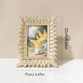 Cadre photo doré en résine avec motif feuille et dimensions de 22x17cm sur fond neutre - Cadre Photo Feuille d'Or 6 Pouces