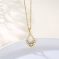 Detailed close-up of water drop pendant with micro-set zircons on a gold chain - Gold