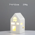 Detail view of a white ceramic house ornament with warm LED light and 7x6x12cm dimensions - YCSQ2250 Glossy White