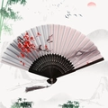 Traditional Chinese folding fan with plum blossom ink painting and gray tassel detail - Plum Blossom Joy - Black Handle