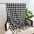 Detail of soft black and white plaid scarf with fringe draped on a beige armchair - Large Black & White Plaid Type 2 (WT142-6)