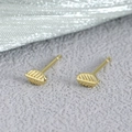 Delicate gold leaf stud earrings with detailed vein texture on a grey background - Leaf