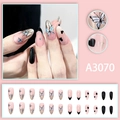 Almond shaped press-on nails with butterfly and heart designs in nude and gold - A3070 (Glue Type)
