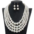 Detailed view of the four-layer pearl necklace and matching earrings on a black bust - Classic 4-Layer Pearl Necklace Earring Set