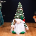 Christmas gnome doll with green polka dot hat and wooden skis for holiday decor - Skiing Glowing Gnome Green