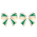 Macro detail of gold bow earrings with green enamel, white pearl and clear rhinestones - Green