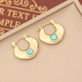 Close-up of golden crescent earrings with green evil eye inlay on a jewelry box - 6# (Gold Crescent Cyan Green Eye)