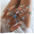 Bohemian silver ring set featuring turquoise stones and vintage animal motifs on hand - 11-Piece Elephant Evil Eye