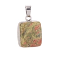 Macro detail of unakite natural stone square pendant with silver metal bail clasp - Unakite