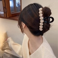 Elegant black hair claw clip with beige heart accents styled on a hair bun - Pink (Heart Decoration)