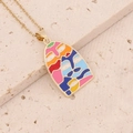 Detailed close-up of a golden face art pendant with vibrant enamel colors on stone - Colorful Abstract Face A