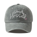 Close-up of Simply Blessed white embroidery and pink cross on washed grey cotton cap - Adjustable / Gray