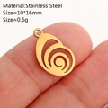 Gold stainless steel teardrop pendant with spiral pattern held for size reference - Spiral / Gold