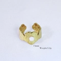 Detailed macro view of a 15mm 14k gold plated flower ring with a white center pearl - White Bead Petal Shape Style