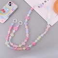 Detalle de la correa de teléfono con cuentas de colores, corazones y lazos de resina - Estilo de Dibujos Animados Brillante Cielo Estrellado